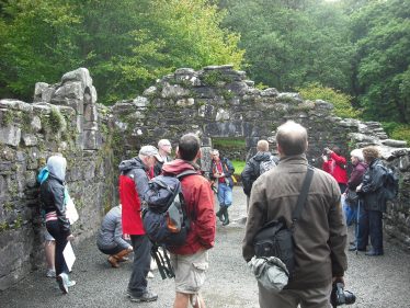 Visitors in Reefert Church, Upper Lake, Glendalough | Joan Kavanagh