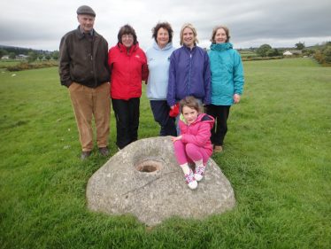 Volunteers and Bullaun stone | Roundwood Tidy Towns