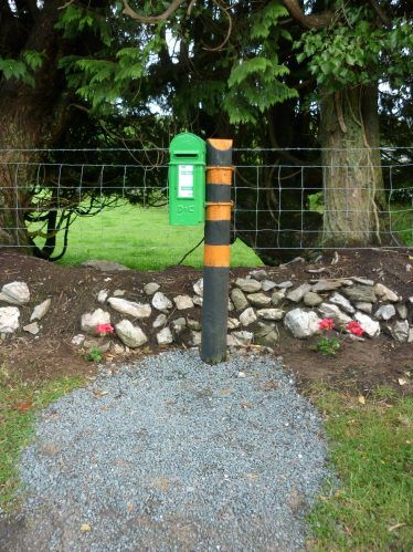 Newly painted feature postbox with stone wall and new planting | The Askanagap Community Development Association