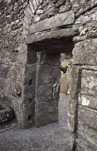 7. The west doorway from within, showing two slots for beams to secure the door from the inside (J. Scarry). | Courtesy of Con Manning & Wordwell Publishing