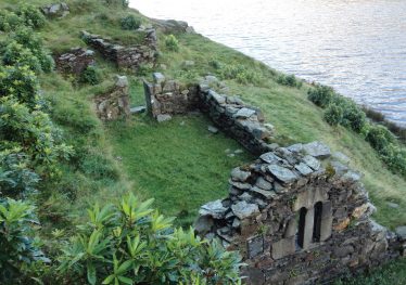 Fig. 1a—View of Temple na Skellig, with the occupational platforms in the background. Fig. 1a—View of Temple na Skellig, with the occupational platforms in the background. | Courtesy of Glendalough Heritage Froum and Wordwell Publishing