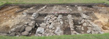 Fig. 7—The up-to-8m wide ditch (dark soils) located between the main monastic complex and St Mary’s church at the Lower Lake. The multiple stone walls and façades may be related to water management. Fig. 7—The up-to-8m wide ditch (dark soils) located between the main monastic complex and St Mary’s church at the Lower Lake. The multiple stone walls and façades may be related to water management. | Courtesy of Glendalough Heritage Froum and Wordwell Publishing
